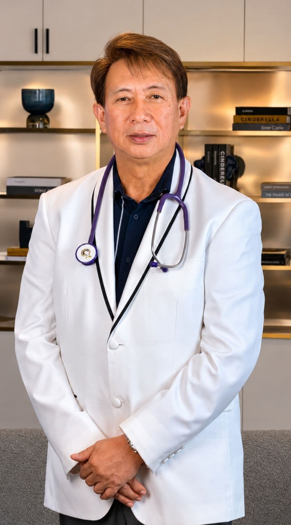 Portrait of Dr. Carlito Cubelo, lead physician at BioRenew, standing in a white medical coat with a stethoscope.